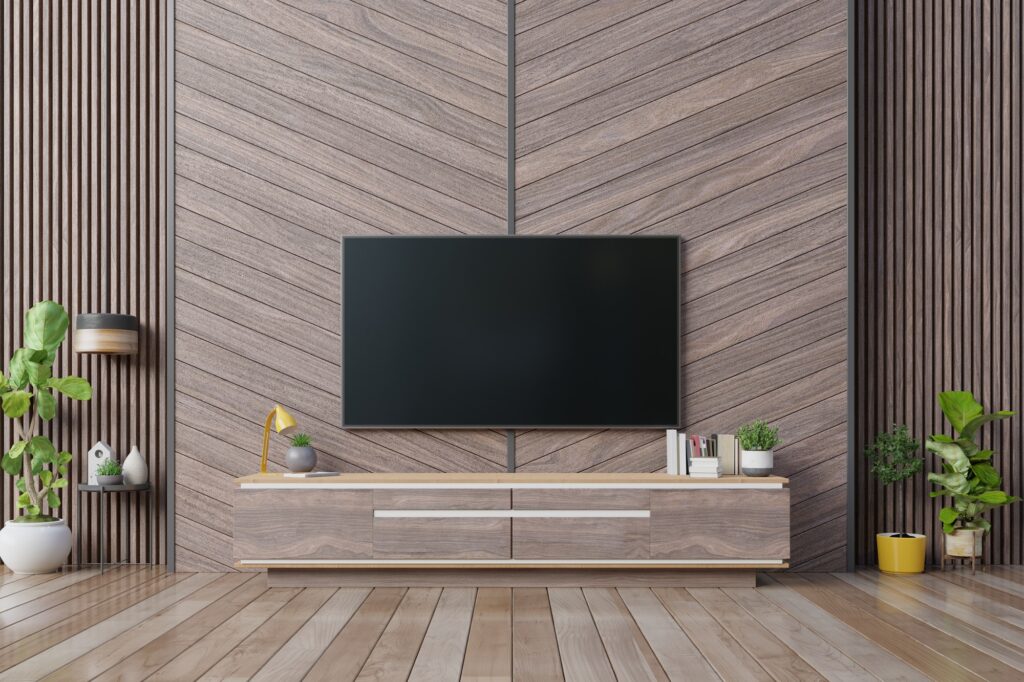 Smart Tv mockup hanging on herringbone wooden wall.